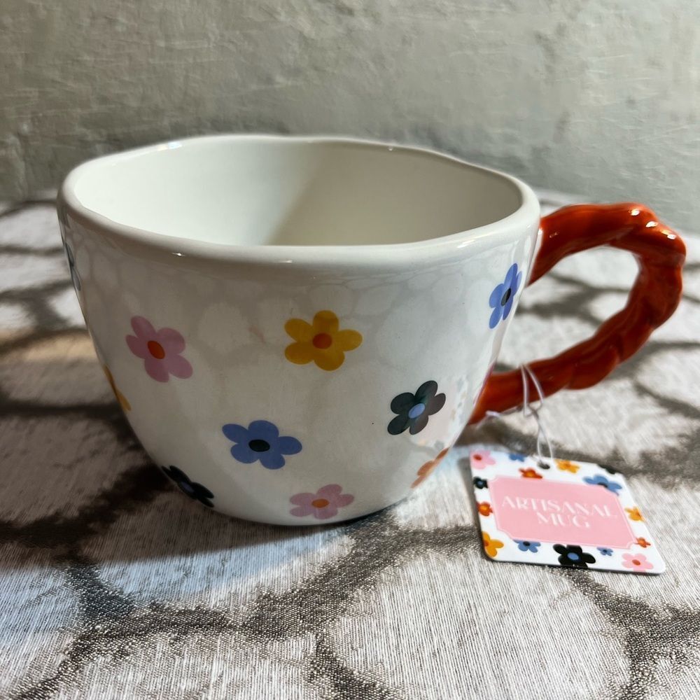 Artisan Mug with Floral Design and Orange Handle